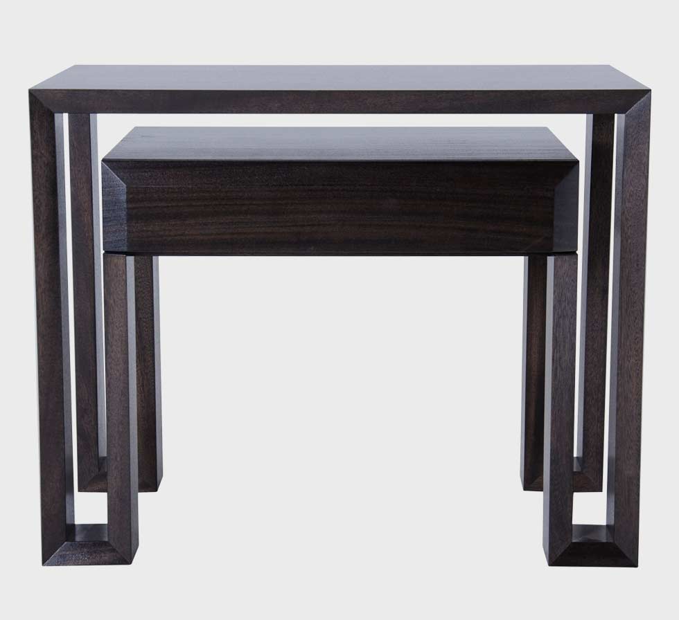 A table with two drawers and a wooden frame.